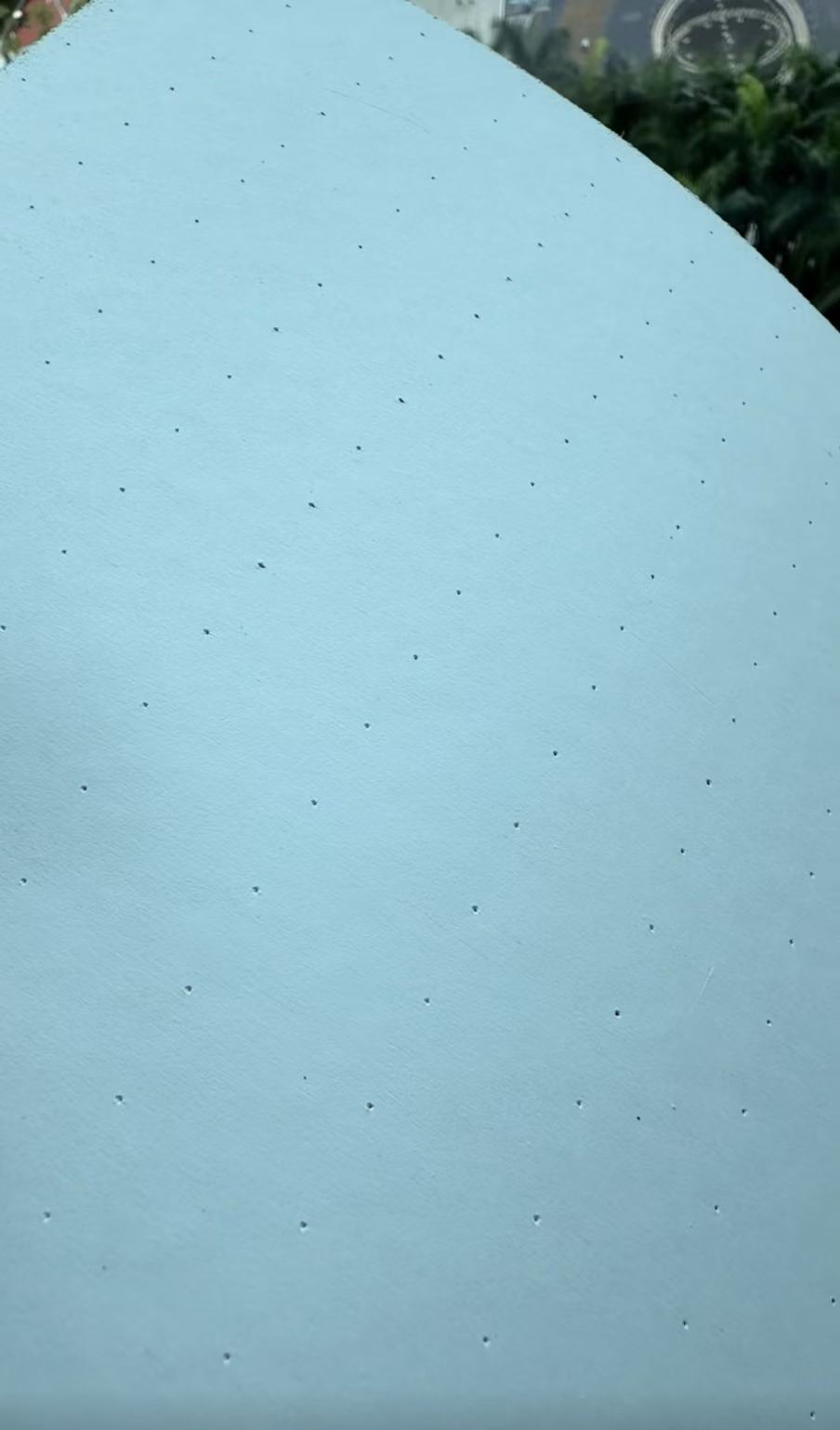 Perforated blue skateboard griptape