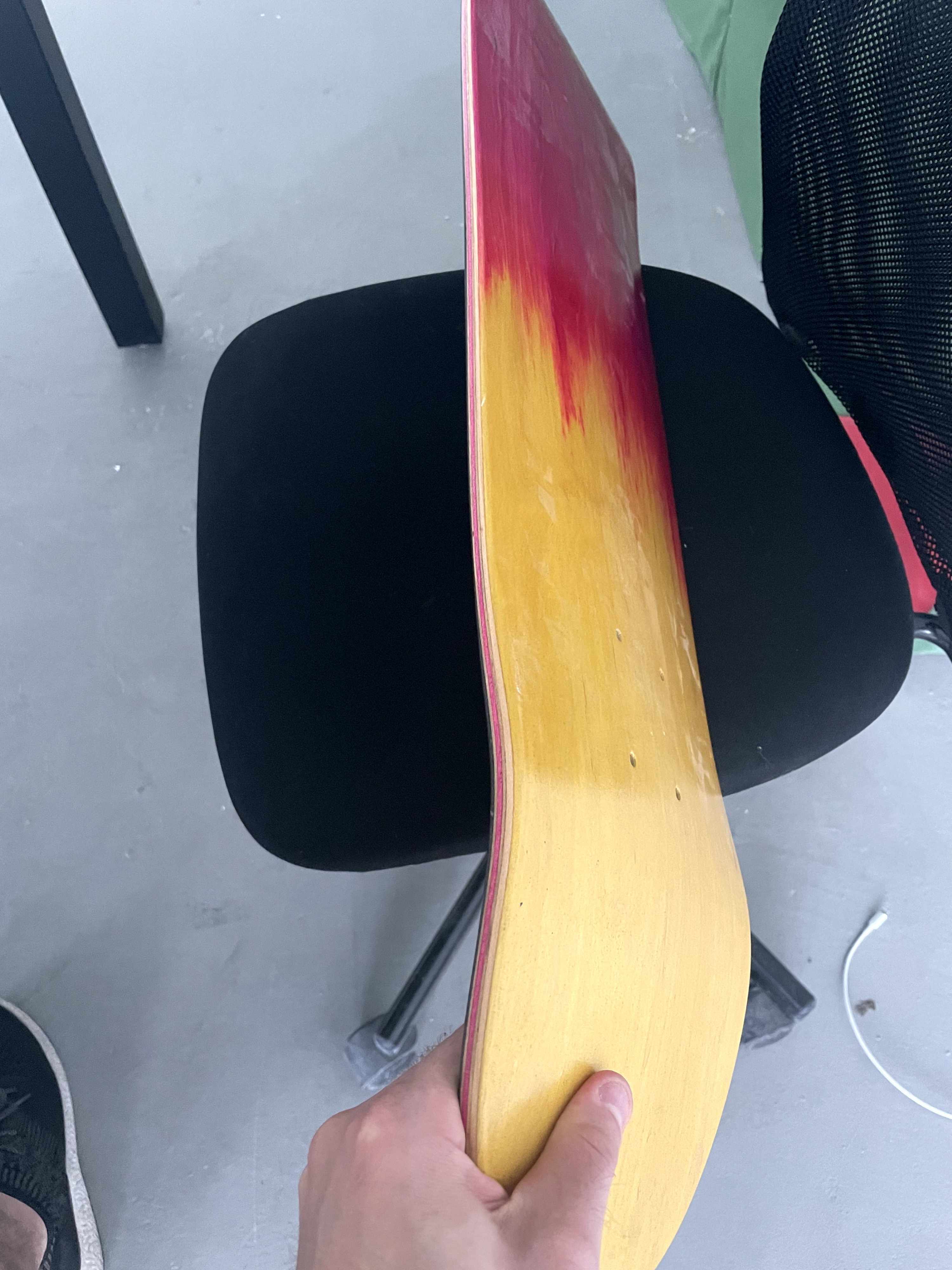 Double dip veneer on a skateboard deck. We dipped the veneer in yellow and pink dye to create this unique look.